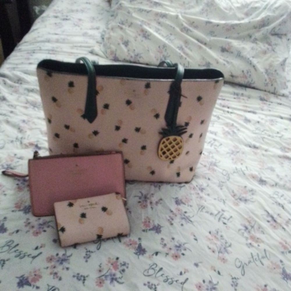 Kate Spade tot bag, matching wallet with a hand bag too.